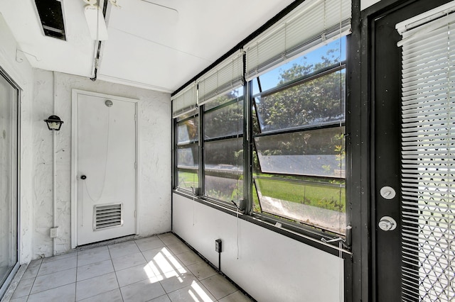 unfurnished sunroom with a wealth of natural light