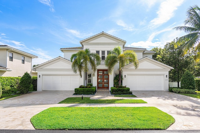 view of front of house with french doors and a garage