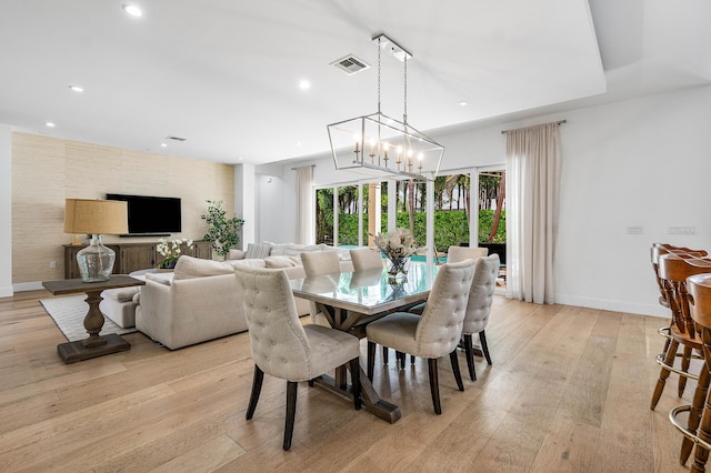 200 NE 6th Ct, Boca Raton, FL 33432 - dining area featuring light wood-style flooring, recessed lighting, baseboards, and a chandelier