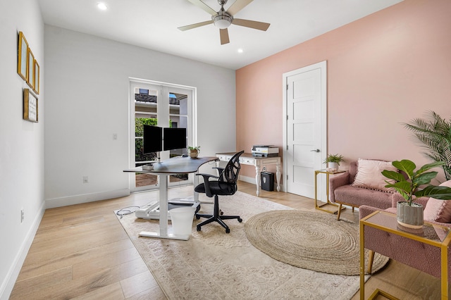 home office featuring ceiling fan and light hardwood / wood-style flooring