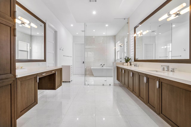 bathroom featuring a notable chandelier, tile patterned flooring, vanity, and separate shower and tub