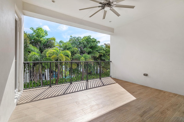 200 NE 6th Ct, Boca Raton, FL 33432 - balcony featuring a ceiling fan and view of wooded area