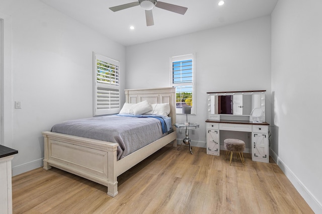 200 NE 6th Ct, Boca Raton, FL 33432 - bedroom featuring light wood finished floors, baseboards, multiple windows, and recessed lighting