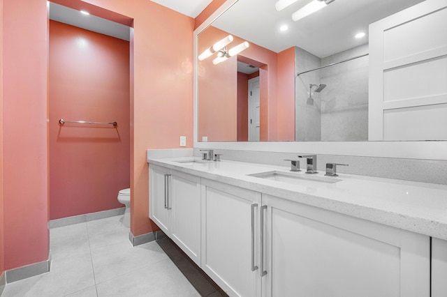 200 NE 6th Ct, Boca Raton, FL 33432 - full bath featuring toilet, double vanity, tile patterned floors, baseboards, and a shower