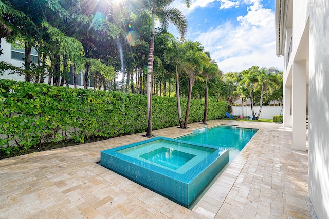 200 NE 6th Ct, Boca Raton, FL 33432 - view of pool with an in-ground hot tub, a patio, and a fenced backyard