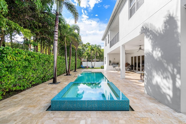 200 NE 6th Ct, Boca Raton, FL 33432 - view of pool with a ceiling fan, a patio, a fenced backyard, and an in-ground hot tub