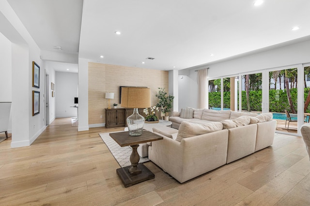 200 NE 6th Ct, Boca Raton, FL 33432 - living room featuring light wood-type flooring, recessed lighting, and baseboards