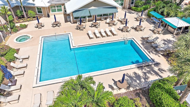 view of pool featuring a hot tub