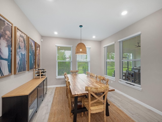 dining space with light wood-type flooring