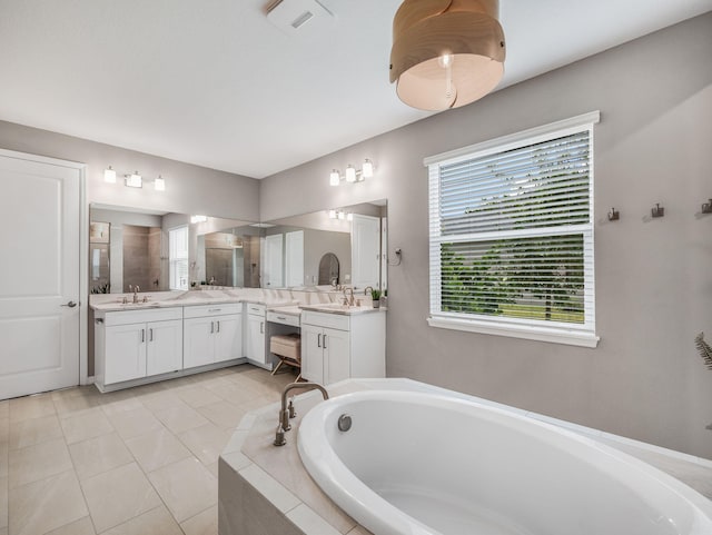 bathroom with vanity, separate shower and tub, and tile patterned floors