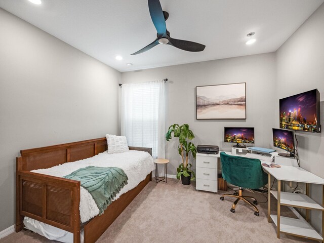 bedroom with light colored carpet and ceiling fan