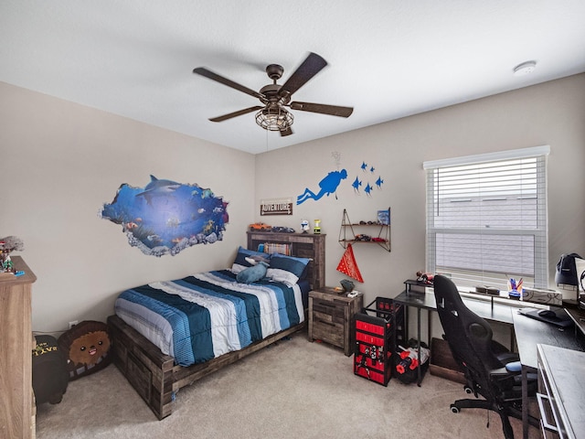 bedroom with ceiling fan and light carpet