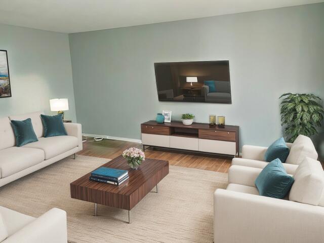 living room featuring baseboards and wood finished floors