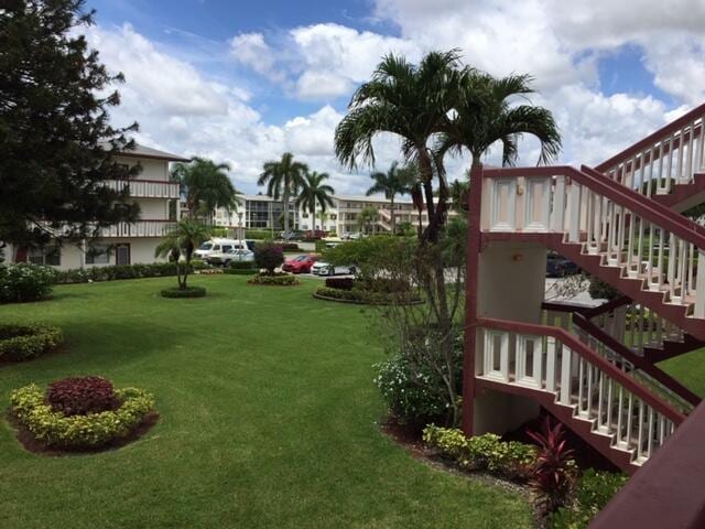 view of yard featuring stairs