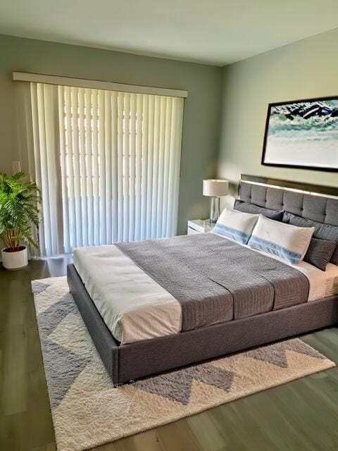 bedroom featuring wood finished floors