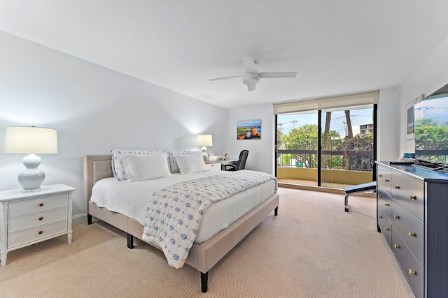 carpeted bedroom with multiple windows, access to exterior, and ceiling fan