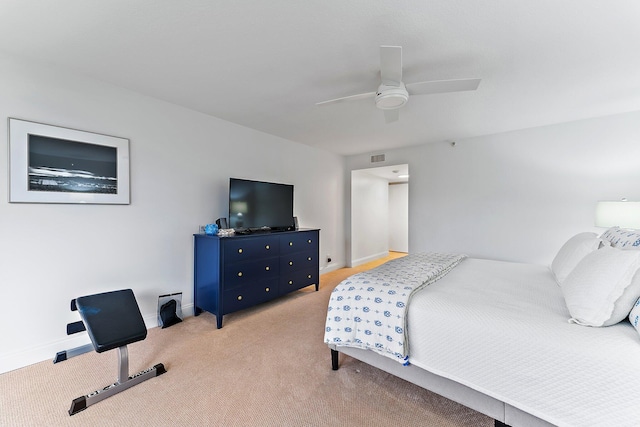 bedroom with ceiling fan and light colored carpet