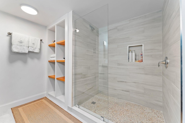 bathroom with a tile shower