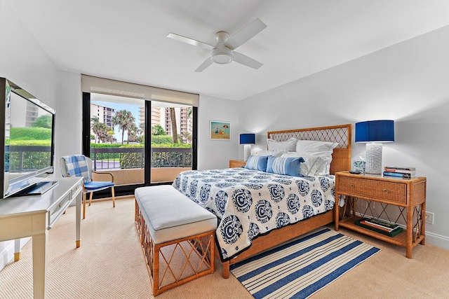 bedroom with light colored carpet, access to outside, and ceiling fan