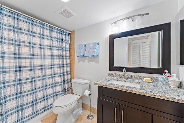 bathroom with tile patterned flooring, vanity, toilet, and curtained shower