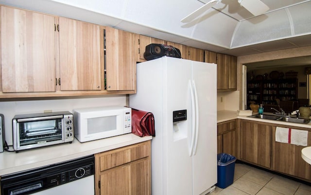 kitchen featuring ceiling fan, sink, light tile patterned floors, and white appliances