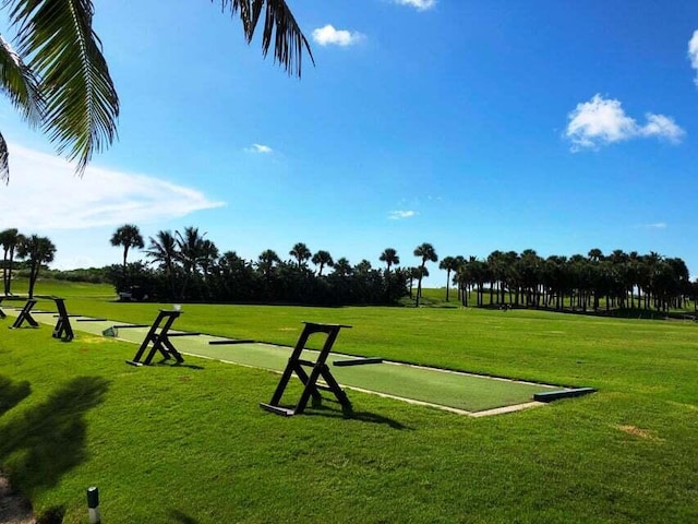 view of property's community with a lawn