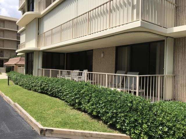 view of home's exterior with a balcony