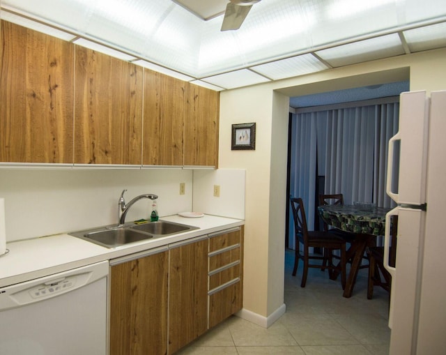 kitchen with ceiling fan, sink, light tile patterned floors, and white appliances