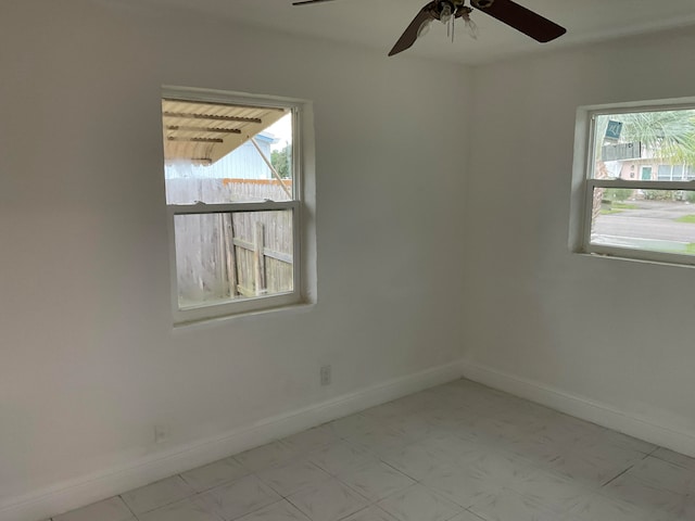 spare room with ceiling fan