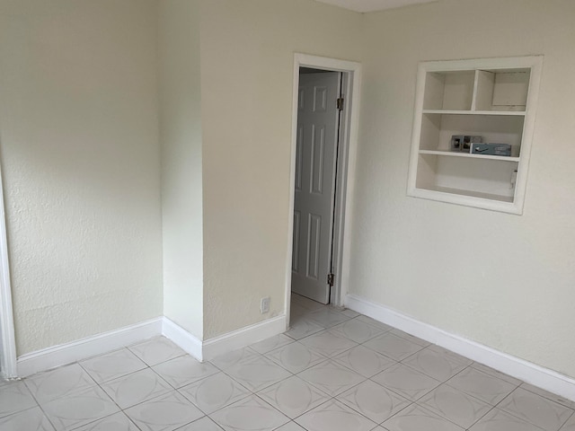 view of tiled spare room