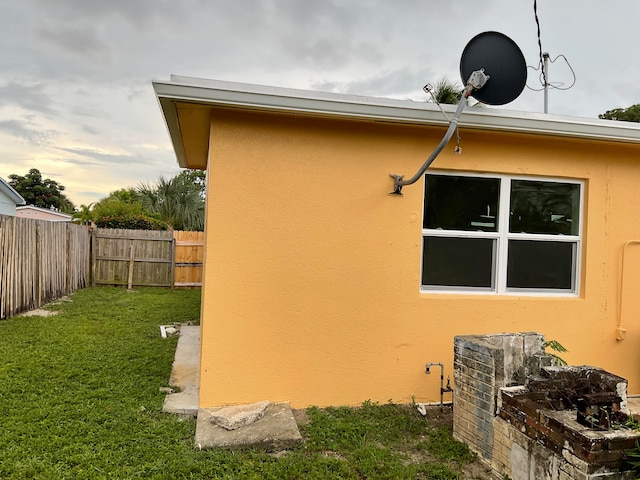 view of home's exterior featuring a lawn