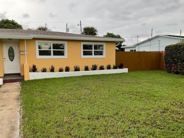 view of front of property with a front lawn