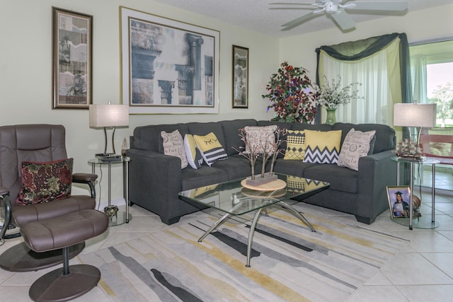 tiled living room featuring ceiling fan and a textured ceiling