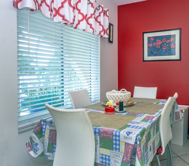 dining area featuring tile patterned flooring