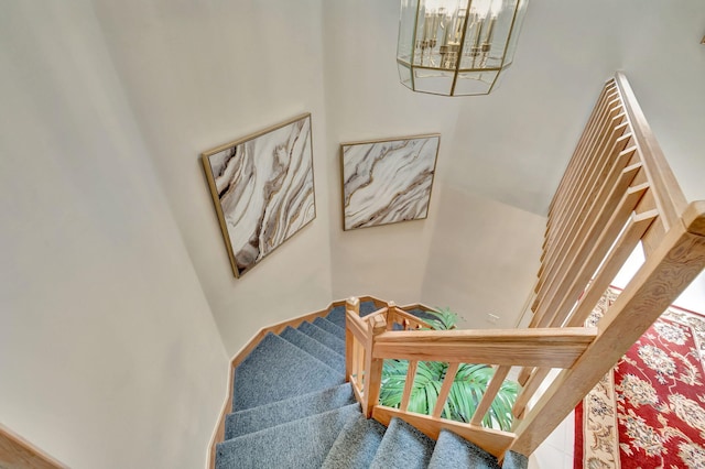 stairway with an inviting chandelier