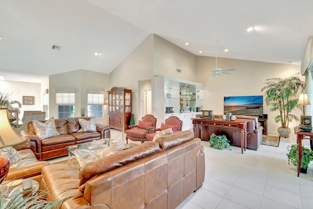 tiled living room with vaulted ceiling and ceiling fan