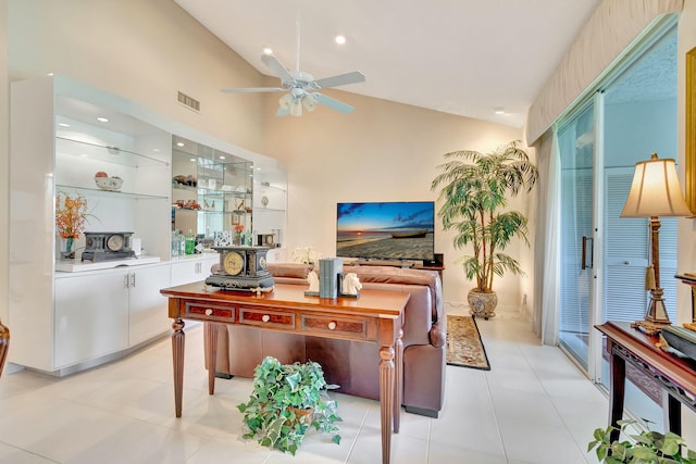 tiled home office featuring ceiling fan