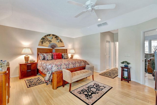 bedroom with hardwood / wood-style floors and ceiling fan