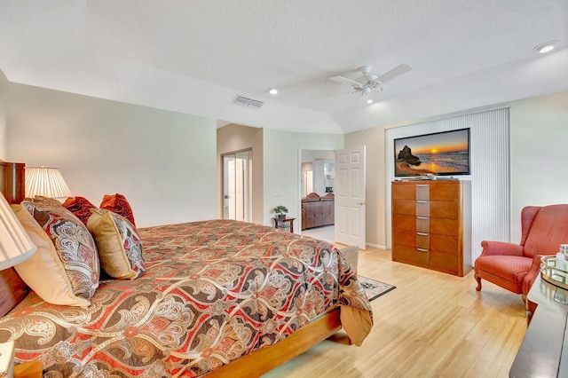 bedroom with a closet, a textured ceiling, ceiling fan, and light hardwood / wood-style floors