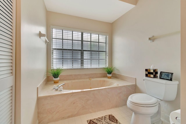 bathroom with tile patterned flooring, toilet, and a washtub