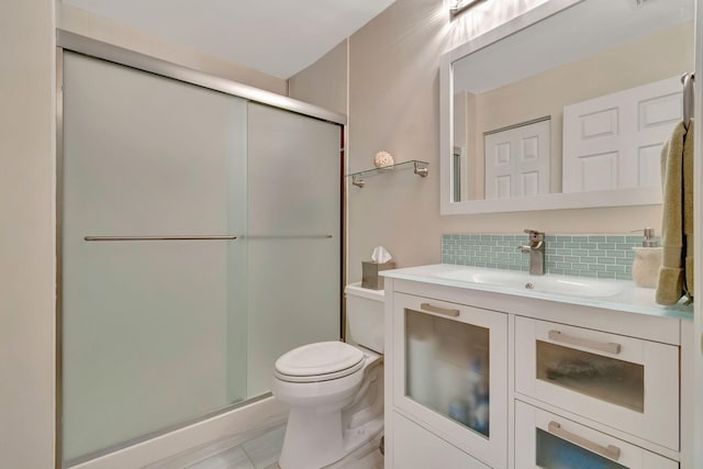 bathroom with walk in shower, toilet, tasteful backsplash, and vanity