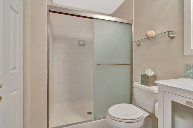 bathroom with vanity, toilet, and walk in shower