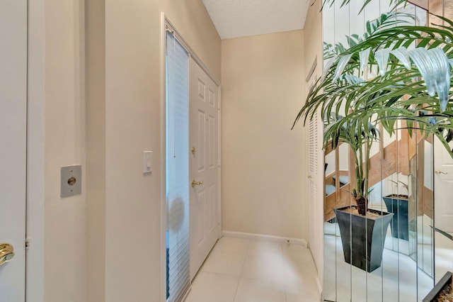 interior space with a textured ceiling