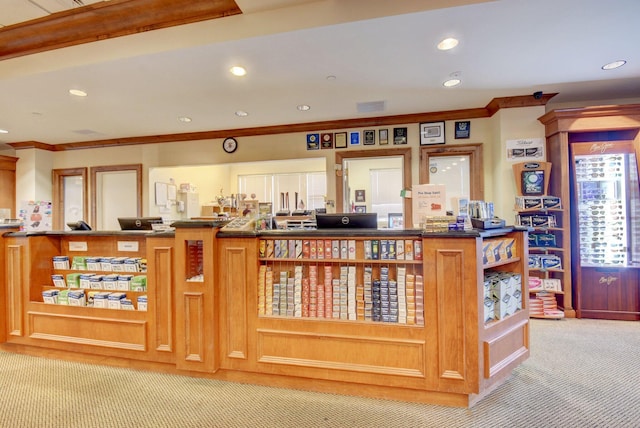 interior space featuring carpet flooring and ornamental molding