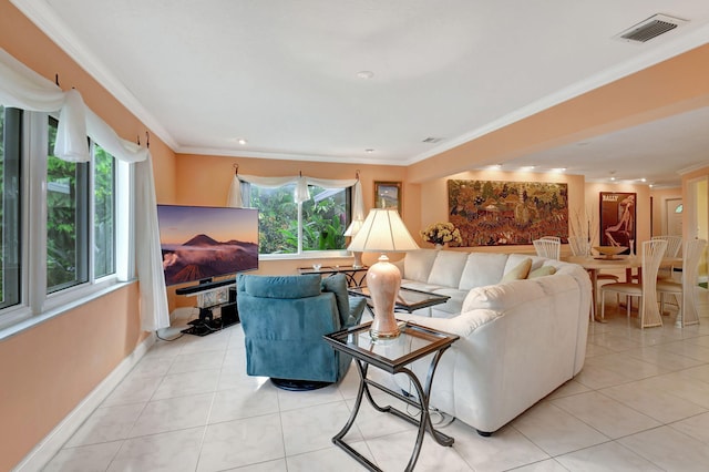 living room featuring ornamental molding and light tile patterned floors