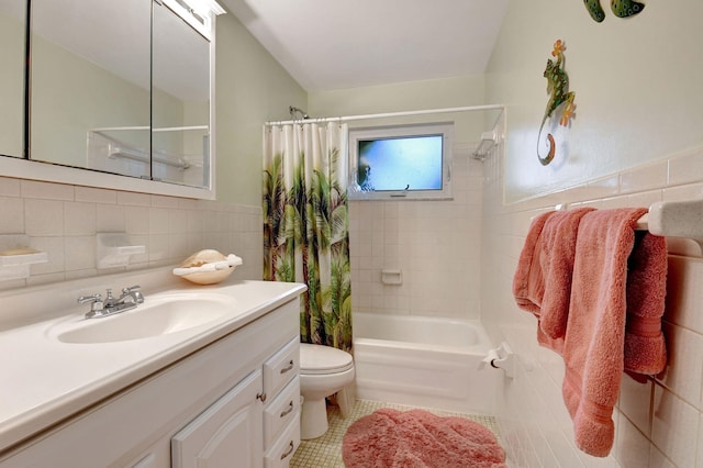 full bathroom featuring tile walls, toilet, shower / tub combo, and vanity