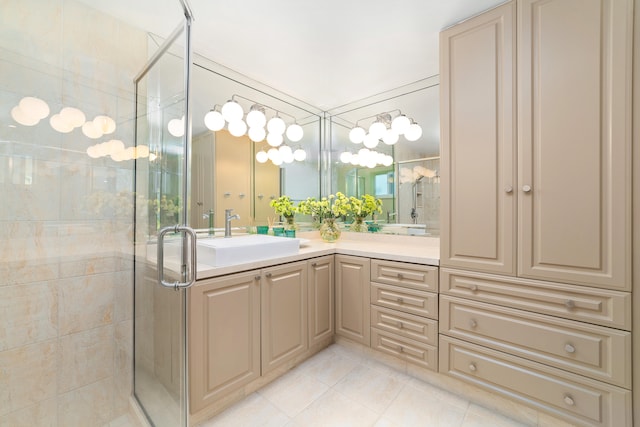 bathroom featuring tile patterned flooring, vanity, and walk in shower