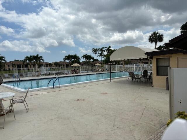 view of pool featuring a patio