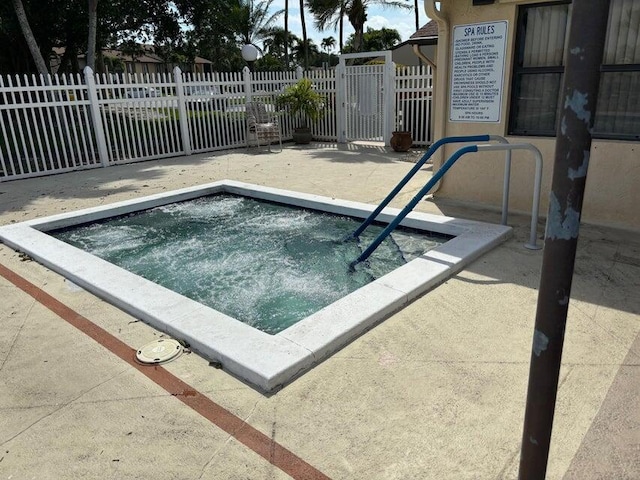 view of pool featuring a hot tub