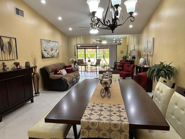 dining area with high vaulted ceiling and ceiling fan with notable chandelier